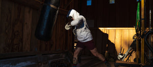leather boxing gloves showing their versatility in a training session in vintage barn