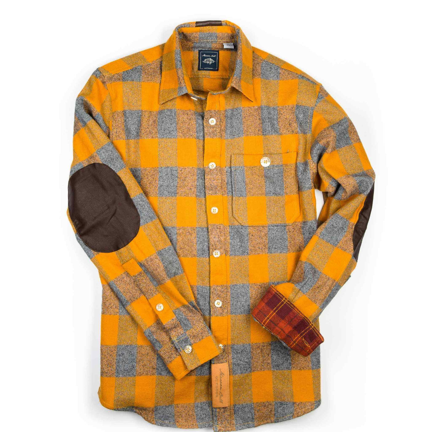 A gold plaid flannel shirt with vegan leather elbow patches & contrast under-cuffs from the Denver, Colorado-based Maroon Bell Outdoor.